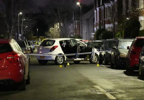 Police at the scene in Lessar Avenue near Clapham Common, south London, where a woman and her two young children have been taken to hospital after a man threw a suspected corrosive substance on Wednesday evening