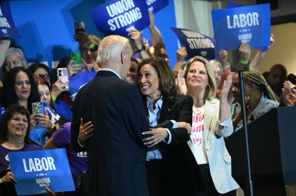 President Joe Biden embraces Vice President and Democratic presidential candidate Kamala Harris greets during a campaign rally at the International Brotherhood of Electrical Workers (IBEW) Local 5 in Pittsburgh, Pennsylvania, on September 2, 2024.
