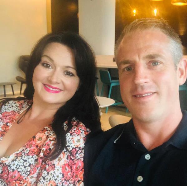 Natalie Buss is pictured with her husband, Elliot.