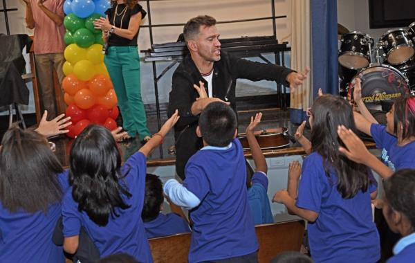 Musical pop star Andy Grammer (pictured) came to PS 22 to sing one of his new songs called "Magic" with the choir today.
