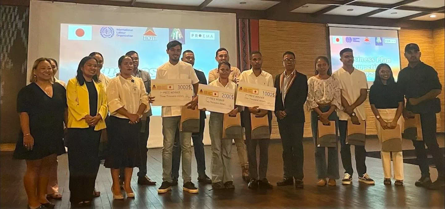 Three winners of business plan competition in Timor-Leste pose for photo 