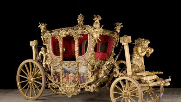 Replica of Britain's gold state coach in auction of props from Netflix's 'The Crown' 
