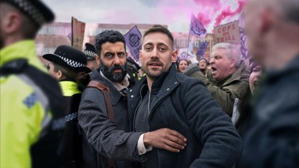 Adeel Akhtar as Sam Malik and Michael Socha as Justin Mitchell in Showtrial season 2