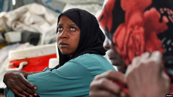 FILE - Families displaced by Rapid Support Forces advances in Sudan's El Gezira and Sennar states shelter at the Omar ibn al-Khattab displacement site, Kassala state, Sudan, July 10, 2024. Women-led groups plan to be a part of Sudan peace talks in Switzerland beginning Aug. 14.