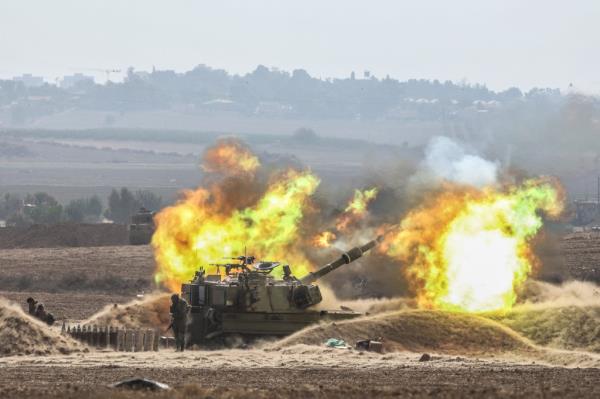Retaliatory shells are fired into Gaza on Oct. 11.