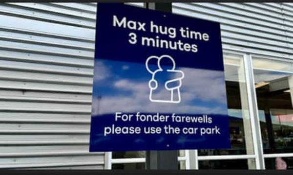 The 3 minute hug sign at Dunedin Airport in New Zealand.