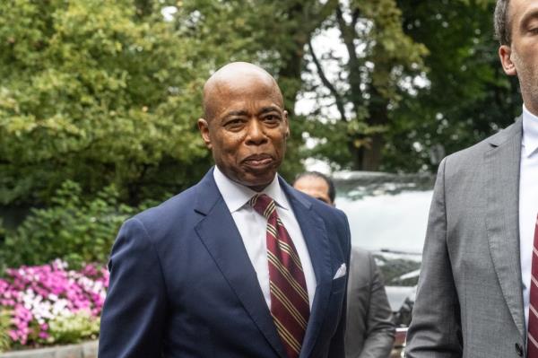 Mayor Eric Adams stands with his lawyer Alex Spiro (R) who delivered remarks to the press on September 26, 2024 in New York City. Adams has been charged with five offenses: conspiracy to commit wire fraud, federal program bribery, solicitation of a contribution by a foreign national, wire fraud, and bribery.