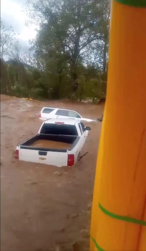 Jacob Ingram, a mold changer at the plastics factory, filmed himself and four others waiting for rescue as bobbing vehicles floated by.