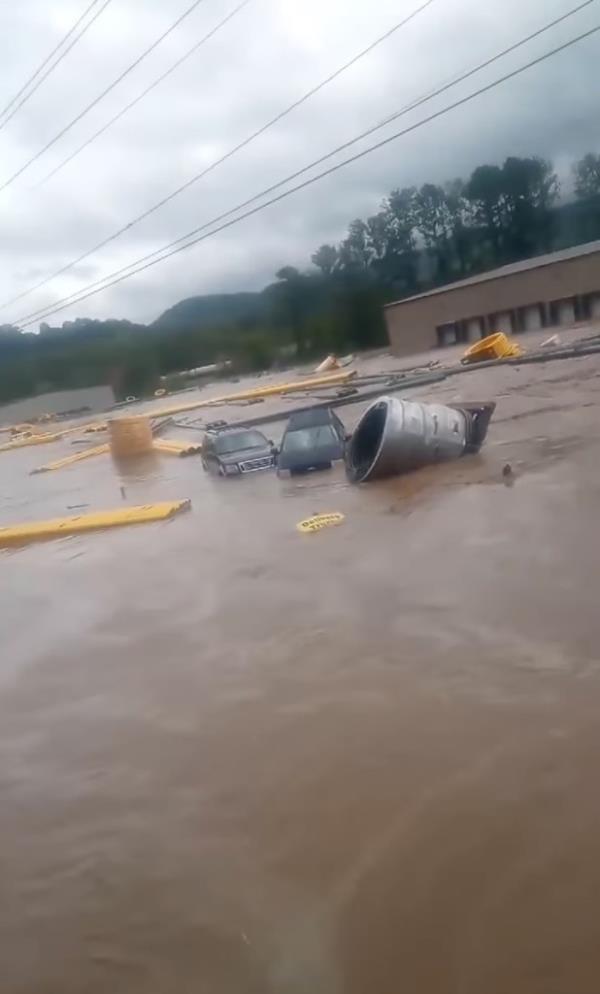 Videos show the brown floodwaters from the adjacent Nolichucky River covering the nearby highway and lapping at the doors of Impact Plastics.