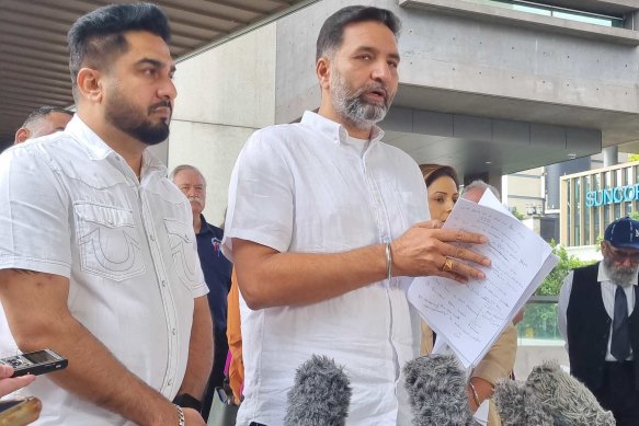 Manmeet Sharma’s family and friends outside the Coroner’s Court on Friday. 