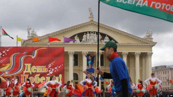 FILE - Schoolchildren perform at a ceremony marking Belarus’ holiday honoring the state flag and emblem in Minsk, Belarus, on May 13, 2012. 