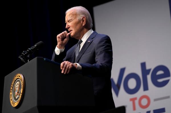 President Joe Biden coughs during an event with Rep. Steven Horsford, D-Nev., in Las Vegas, Tuesday, July 16, 2024. 