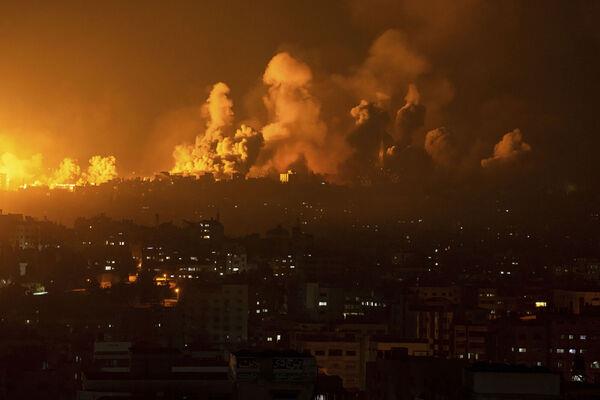 Fire and smoke rise following an Israeli airstrike, in Gaza City, Sunday, Oct. 8, 2023. (AP Photo/Fatima Shbair) Fire and smoke rise following an Israeli airstrike, in Gaza City, Sunday, Oct. 8, 2023. (AP Photo/Fatima Shbair)