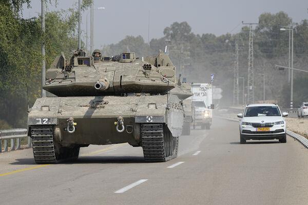Israeli tank heads south near Sderot, Israel, Sunday, Oct.8, 2023. (AP Photo/Ohad Zwigenberg) Israeli tank heads south near Sderot, Israel, Sunday, Oct.8, 2023. (AP Photo/Ohad Zwigenberg)