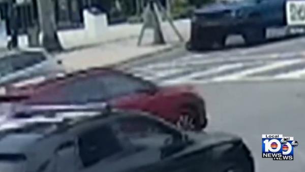 Esmat Ahmed Ibrahim Khedr, 63, is seen riding her electric bicycle toward an intersection steps away from the Miami Beach Police Headquarters on April 28 when she was run over by a blue Ford Bronco.