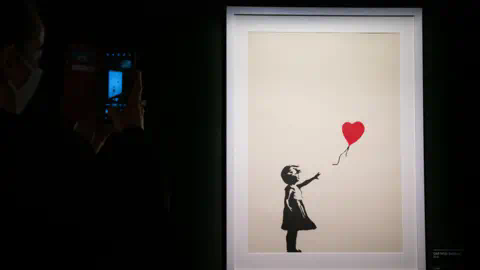 PA Girl with Balloon on display at The Art of Banksy exhibition at 50 Earlham Street, London.