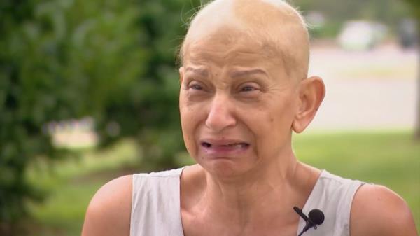 Amal Hanna, 60, is seen crying as she described what happened.
