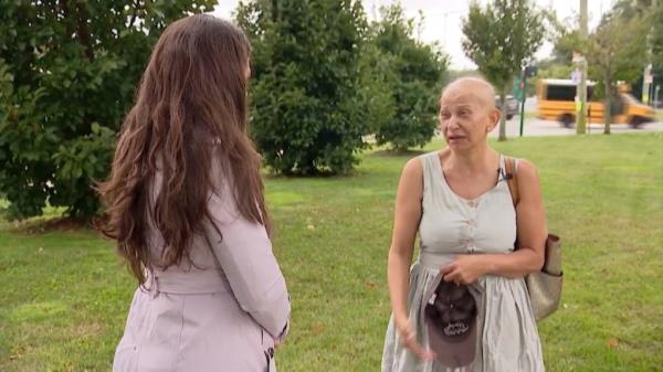 Hanna is pictured speaking with News 12 Long Island.