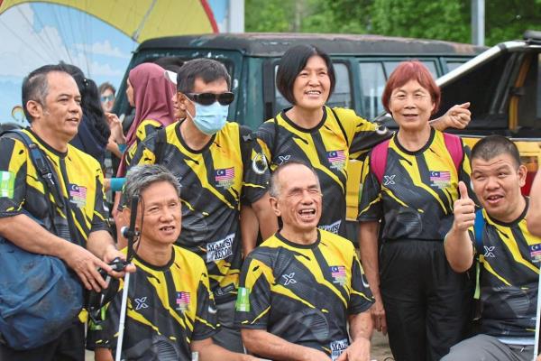 Tam (seated, centre) loves to take on new challenges.