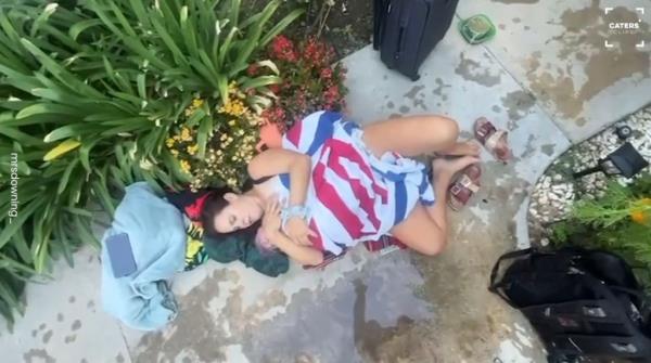 Her husband later filmed her clutching their newborn daughter -- Lilybella -- on the path outside their home.
