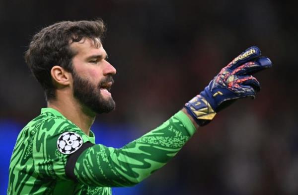 Alisson Becker of Liverpool gestures during the UEFA Champions League 2024/25 League Phase MD1 match between AC Milan and Liverpool
