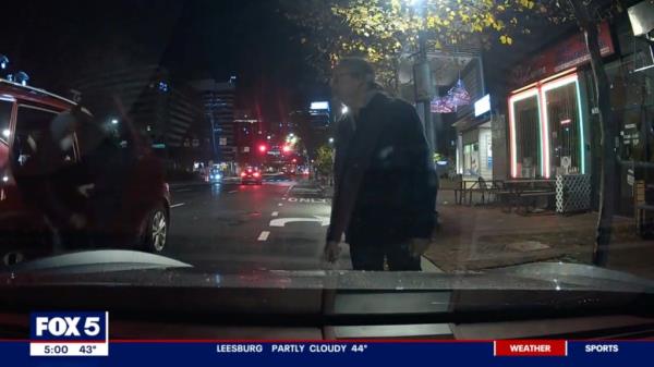 Dashcam footage shows an unidentified suspect exiting a red SUV and approaching the victim.