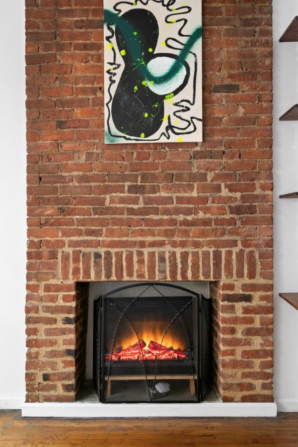 Charming exposed brick and a fireplace