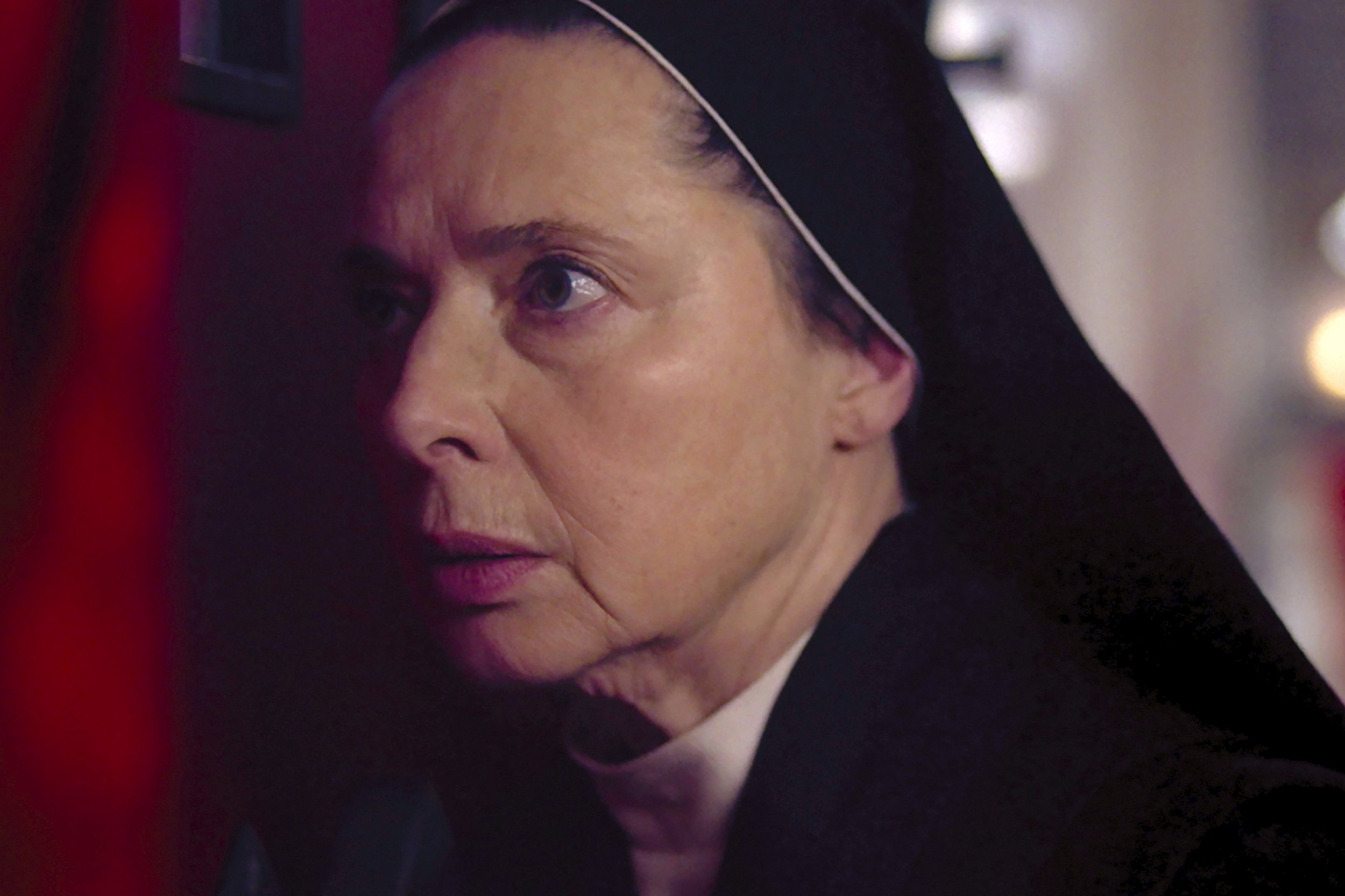 Isabella Rossellini as Sister Agnes looks worried in a scene from Conclave