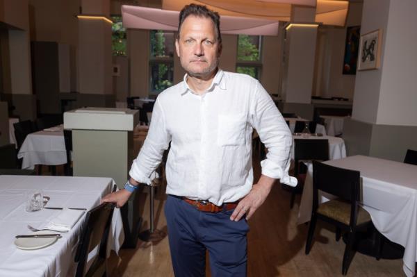Bret Csencisitz, owner of Gotham Bar and Grill in Manhattan, standing in the restaurant