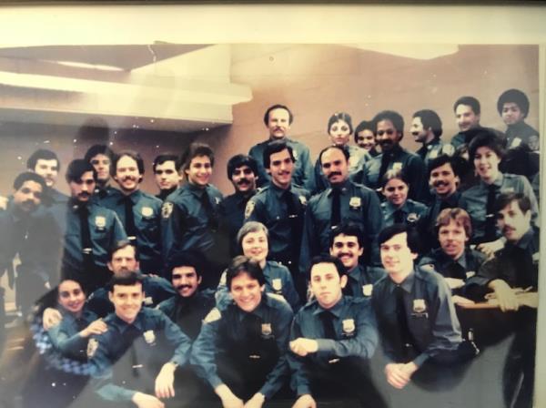 Werdann is in the front row, 2nd from the right. in an image of their academy class in uniform