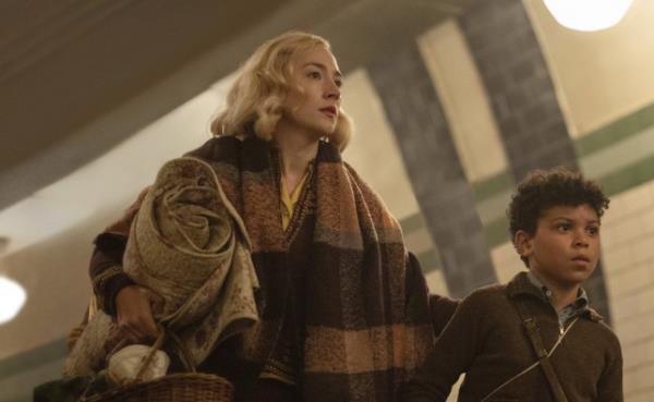 Saoirse Ronan, left, and Elliott Heffernan in a scene from Blitz wearing era-appropriate World War Two clothes