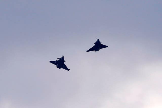 Two French Dassault Rafale fighter jets fly after a signing ceremony between French President Emmanuel Macron and Croatia’s Prime Minister Andrej Plenkovic in Zagreb, Croatia