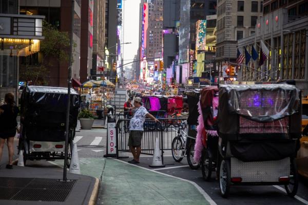 pedicab drivers look for passengers