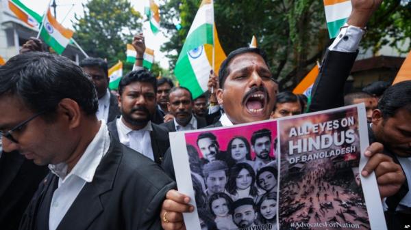 FILE - People protest against recent attacks on Hindus in Bangladesh, in Hyderabad, India, Aug. 14, 2024.