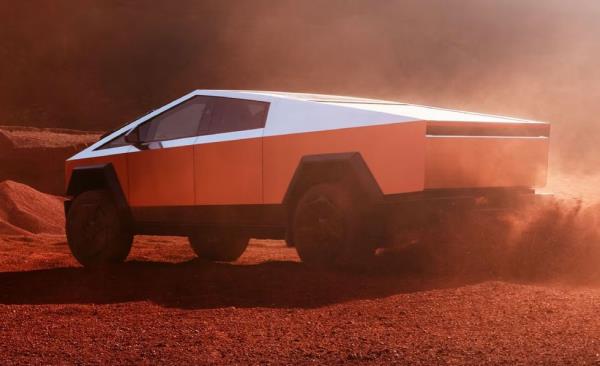 2024 tesla cybertruck driving in dirt