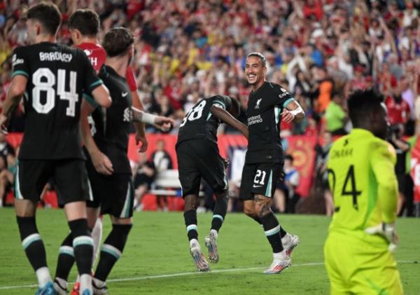 Liverpool players celebrate a goal against Manchester United in pre-season in August 2024