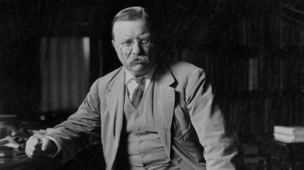 Teddy Roosevelt raises his hat