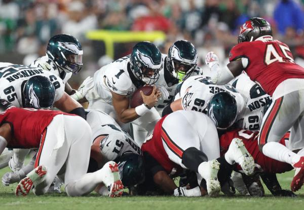 Jalen Hurts of the Philadelphia Eagles sneaks forward against the Buccaneers. (Photo by Mike Carlson/Getty Images)
