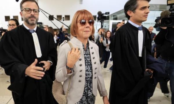 Gisèle Pelicot exits court flanked by her lawyers in Avignon. She accused judges in the case of treating her like the guilty party.