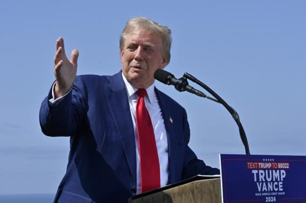 Donald J. Trump gives remarks to the press at Trump National Golf Club