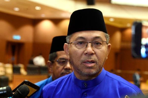 Ex-Perlis MB Azlan Man, charged with making and receiving false claims from illegal activities, sends legal representation to AGC
