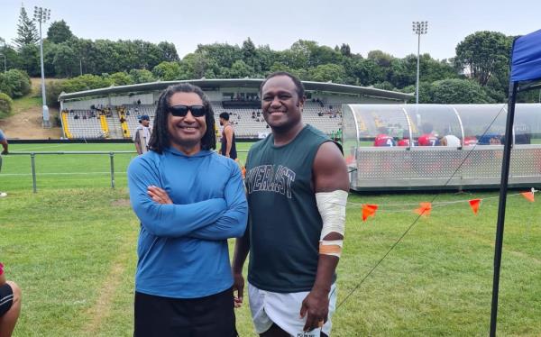 Former Fijian 7s star Pio Tuwai, right, with a friend at the Bula 7s tournament on Saturday.