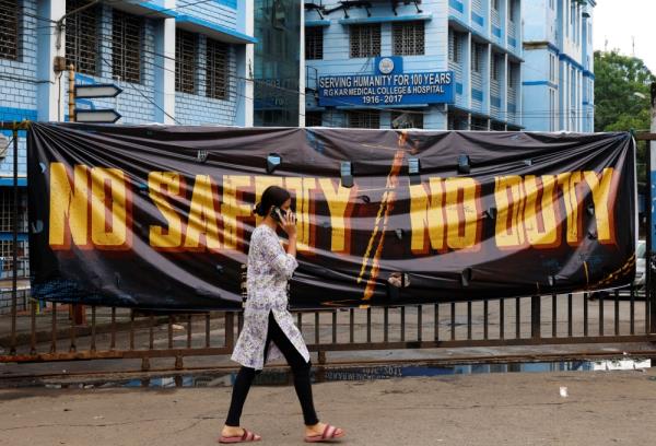 A woman walks past a closed gate of R G Kar Medical College and Hospital in Kolkata, India, August 19, 2024. — Reuters pic