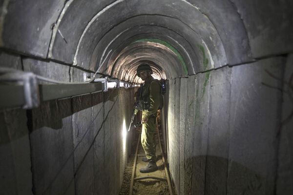 An Israeli army officer gives journalists a tour of a tunnel allegedly used by Palestinian militants for cross-border attacks, at the Israel-Gaza Border July 25, 2014. Picture: AP Photo/Jack Guez, Pool, File An Israeli army officer gives journalists a tour of a tunnel allegedly used by Palestinian militants for cross-border attacks, at the Israel-Gaza Border July 25, 2014. Picture: AP Photo/Jack Guez, Pool, File