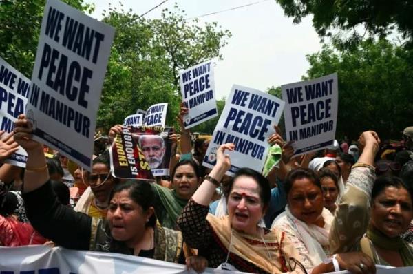 Women burn down house of accused from India naked women video