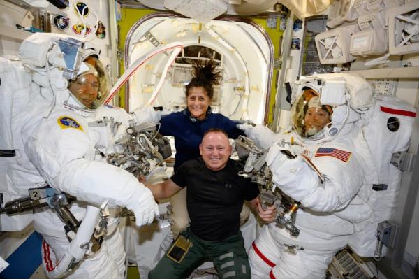  In this photo provided by NASA, Boeing Crew Flight Test astronauts Suni Williams and Butch Wilmore, center, pose with Expedition 71 Flight Engineers Mike Barratt, left, and Tracy Dyson, aboard the International Space Station's Quest airlock on June 24, 2024