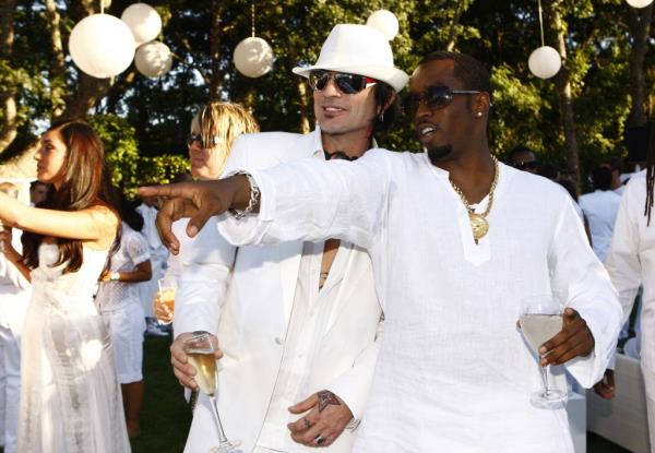 Diddy and Tommy Lee both smiling at a party
