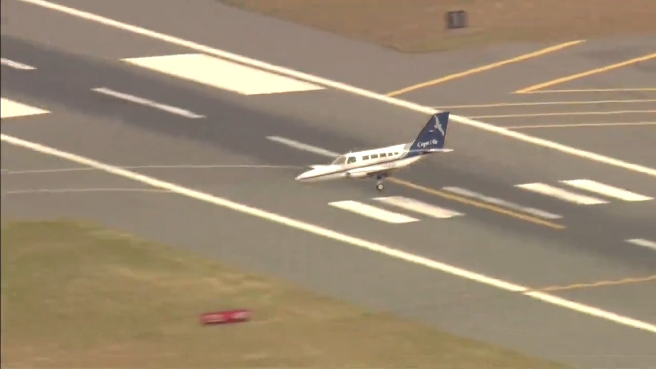 A Cape Air plane is moments from landing at a runway at Boston Logan International Airport