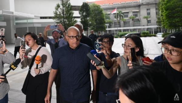 Former transport minister S Iswaran arrives at the State Courts to surrender and begin jail term