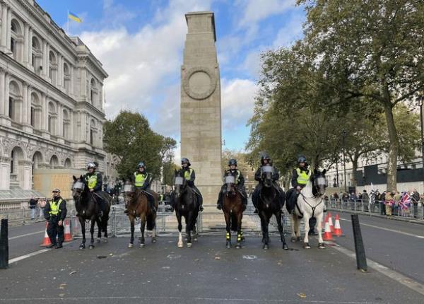A group of police on horseback hold a gathering near the Cenotaph war memorial in Whitehall,